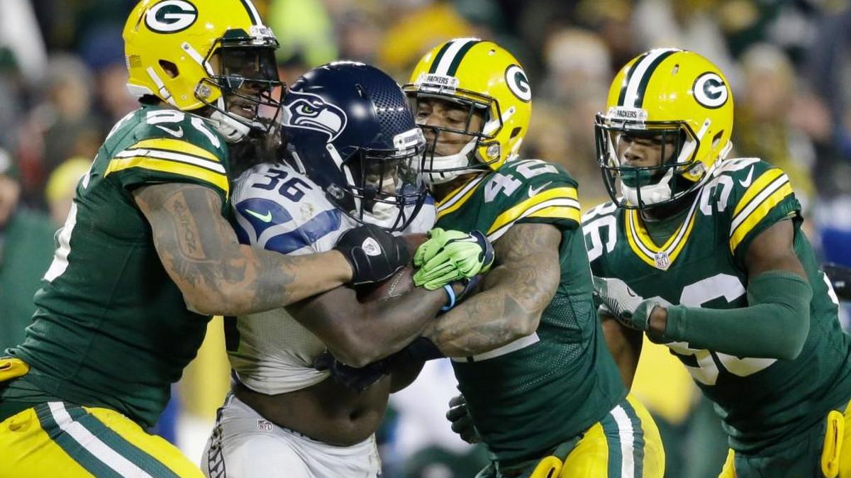 Seahawks running back Alex Collins (36) had a late fumble Sunday against Green Bay.