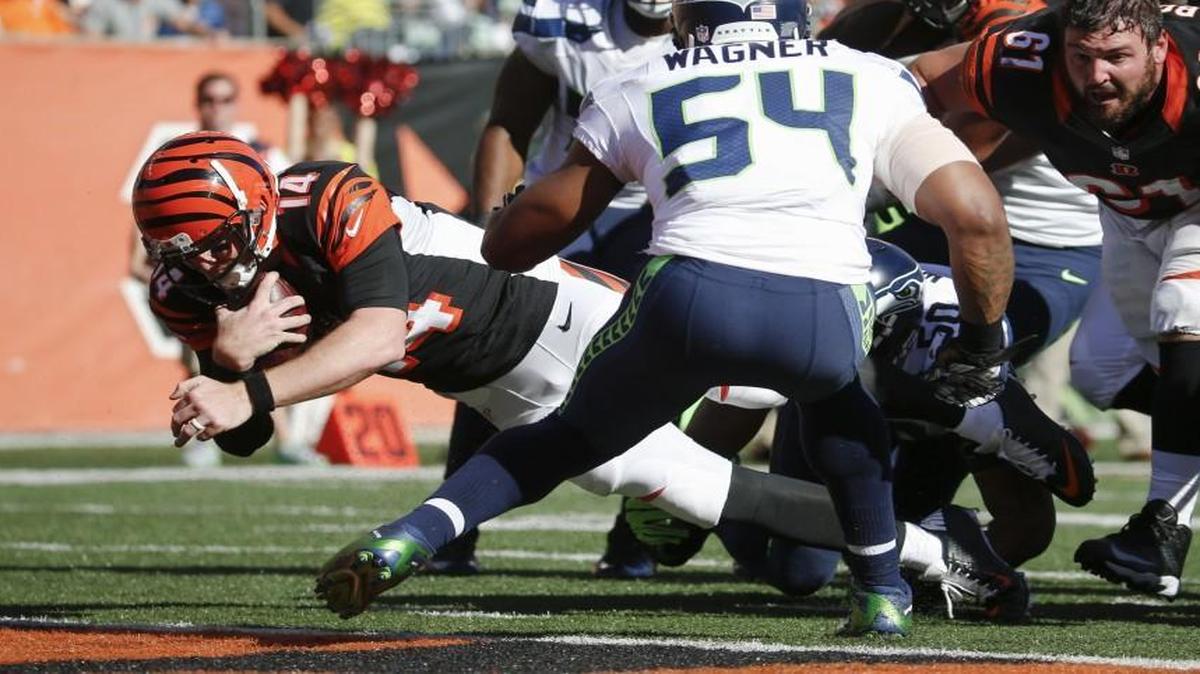 
Bengals quarterback Andy Dalton scores a touchdown last week, as Cincinnati rallied from a 17-point fourth-quarter deficit to defeat the Seahawks in overtime.
