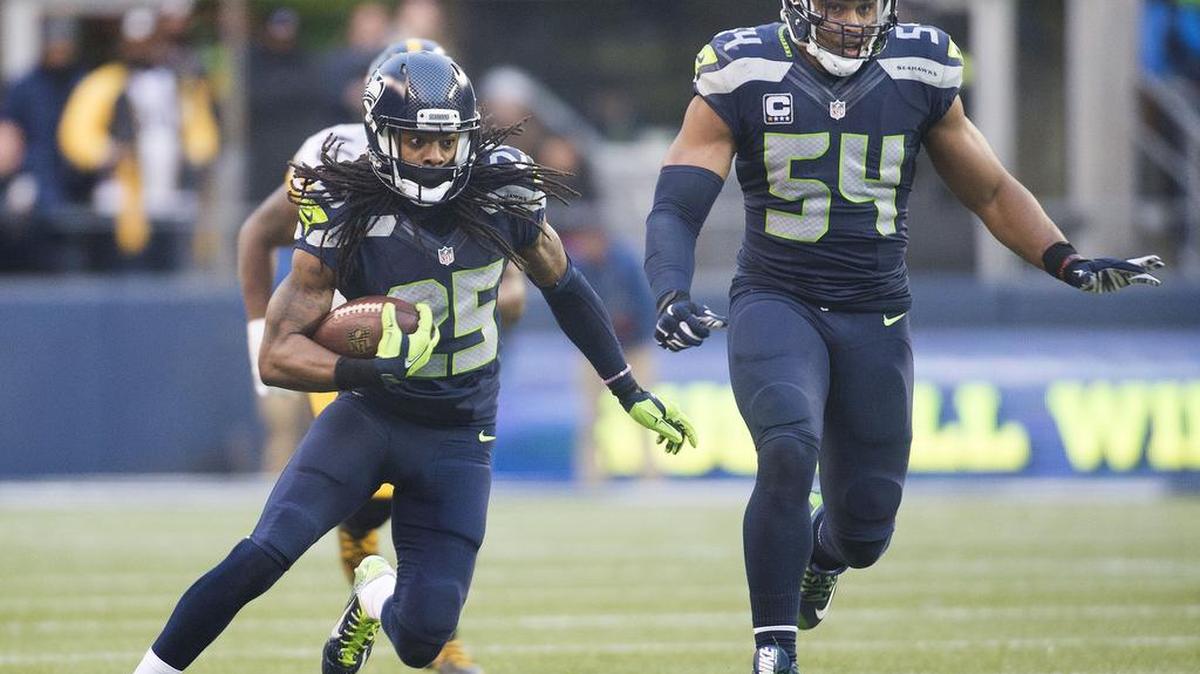 The Seahawks’ Richard Sherman returns an interception against the Steelers. Seattle had four picks Sunday.