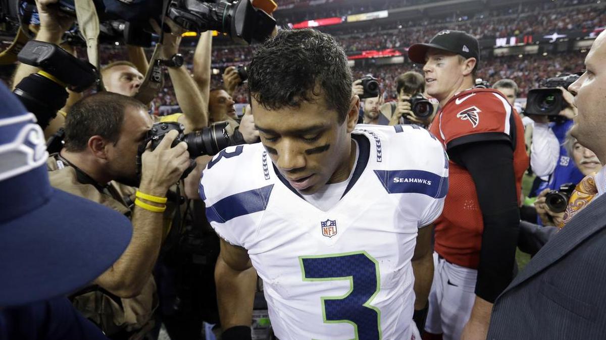 Seahawks quarterback Russell Wilson (3) leaves the Georgia Dome field after shaking hands with Falcons quarterback Matt Ryan after Atlanta edged Seattle, 30-28, in a playoff game in January 2013.