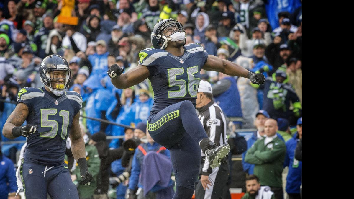 
Defensive Cliff Avril, right, is the latest example of how coach Pete Carroll enlists veterans to help him keep his message fresh entering his sixth training camp as the Seahawks’ coach. 
