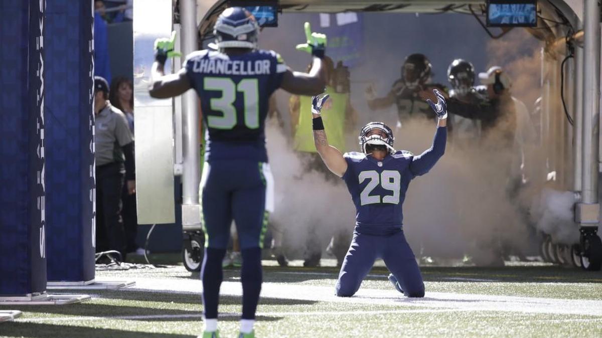 Seattle’s Kam Chancellor (31) and Earl Thomas run out of the tunnel before for a home game against Chicago on Sept. 27. The cornerstones of the “Legion of Boom” have faced scrutiny this season because the secondary has struggled to cover tight ends.