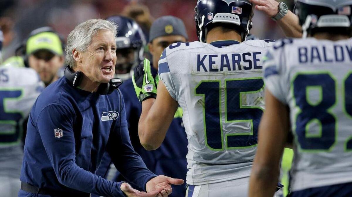 Seattle Seahawks head coach Pete Carroll cheers after a Jermaine Kearse (15) touchdown against the Arizona Cardinals during the first half of an NFL football game, Sunday, Jan. 3, 2016, in Glendale, Ariz.