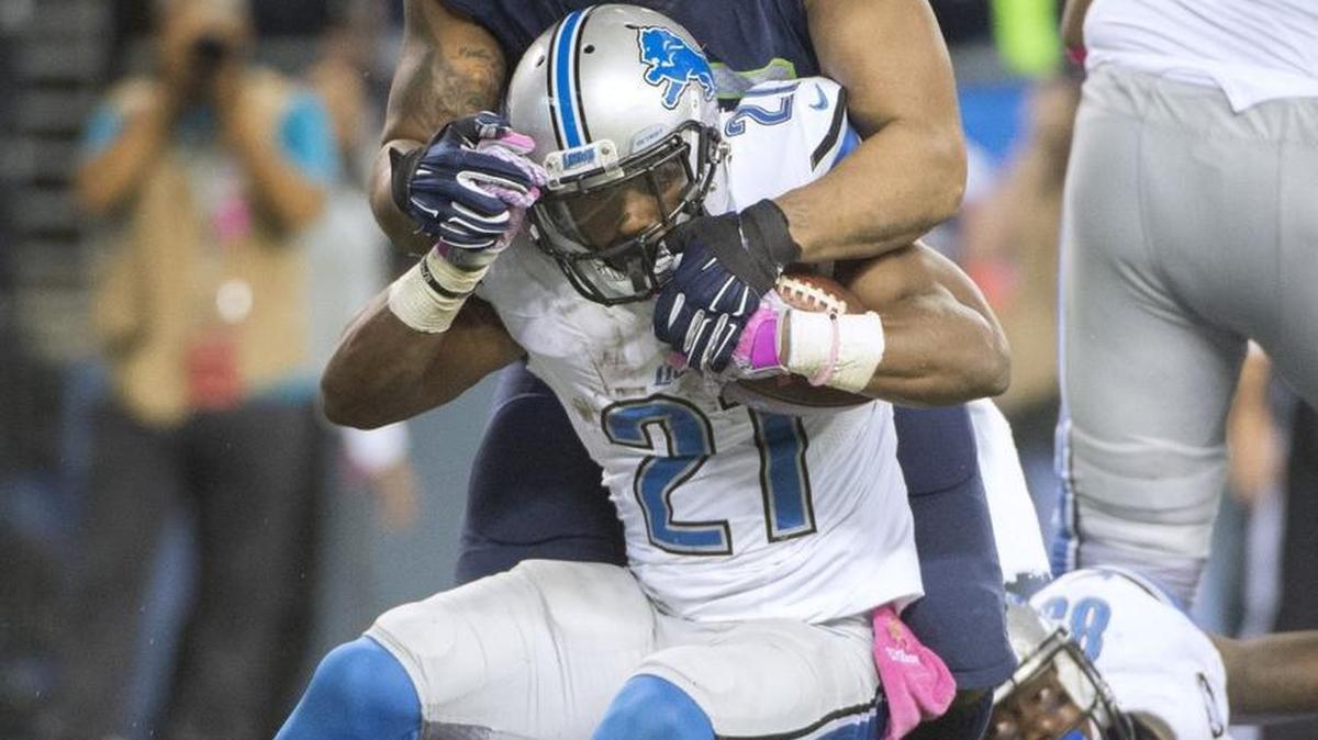 Seahawks defensive lineman Michael Bennett tackles Lions running back Ameer Abdullah for a loss during the Oct. 5 game at CenturyLink Field.