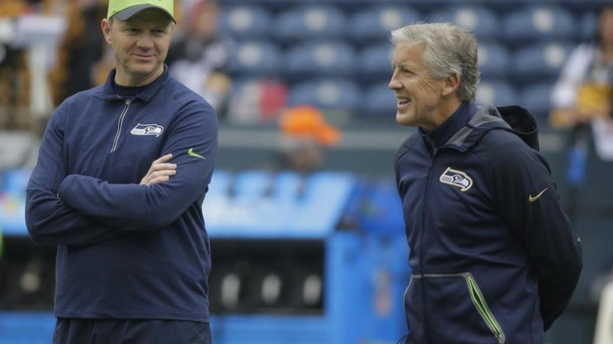 Seattle Seahawks head coach Pete Carroll, right, stands with offensive coordinator Darrell Bevell before an NFL football game against the Pittsburgh Steelers, Sunday, Nov. 29, 2015, in Seattle.