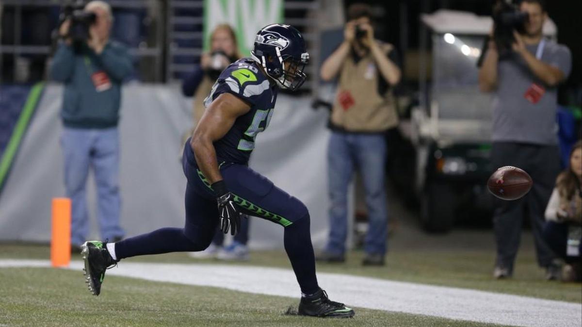 
Seattle Seahawks outside linebacker K.J. Wright watches as a fumble by Detroit Lions wide receiver Calvin Johnson goes out of the end zone late in the fourth quarter Monday night. 
