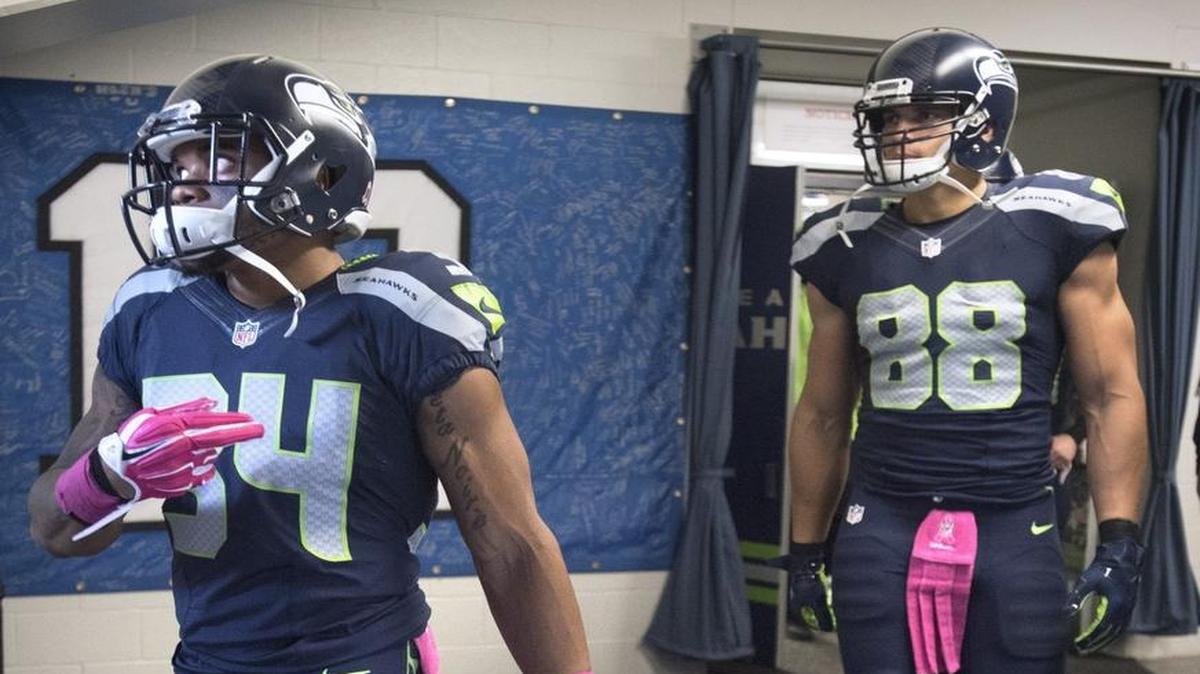 Seahawks running back Thomas Rawls and tight end Jimmy Graham leave the locker room before the Monday Night Football game against the Detroit Lions at CenturyLink Field in Seattle on Oct. 5, 2015.