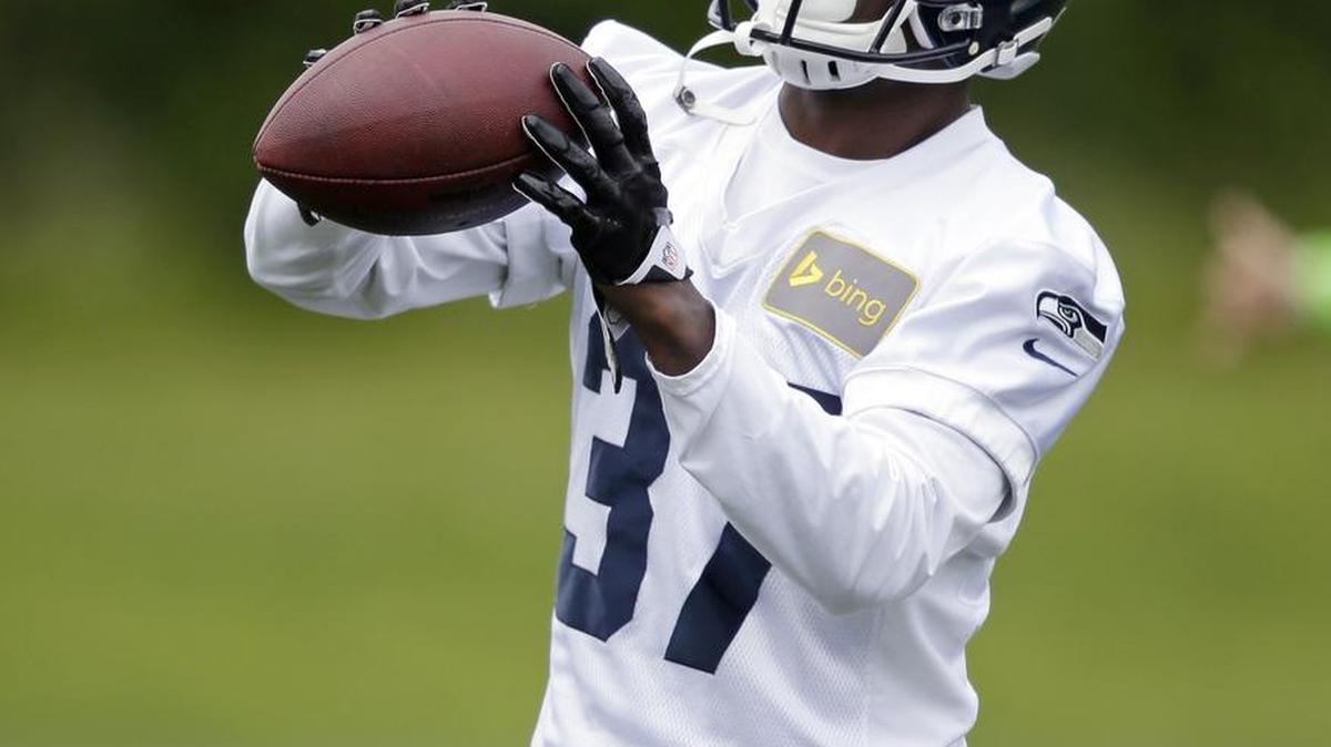 
Seattle Seahawks safety Dion Bailey works drills during an organized team activity practice in Renton in 2014. Bailey has moved up to the team’s top safety spot with Kam Chancellor holding out.
