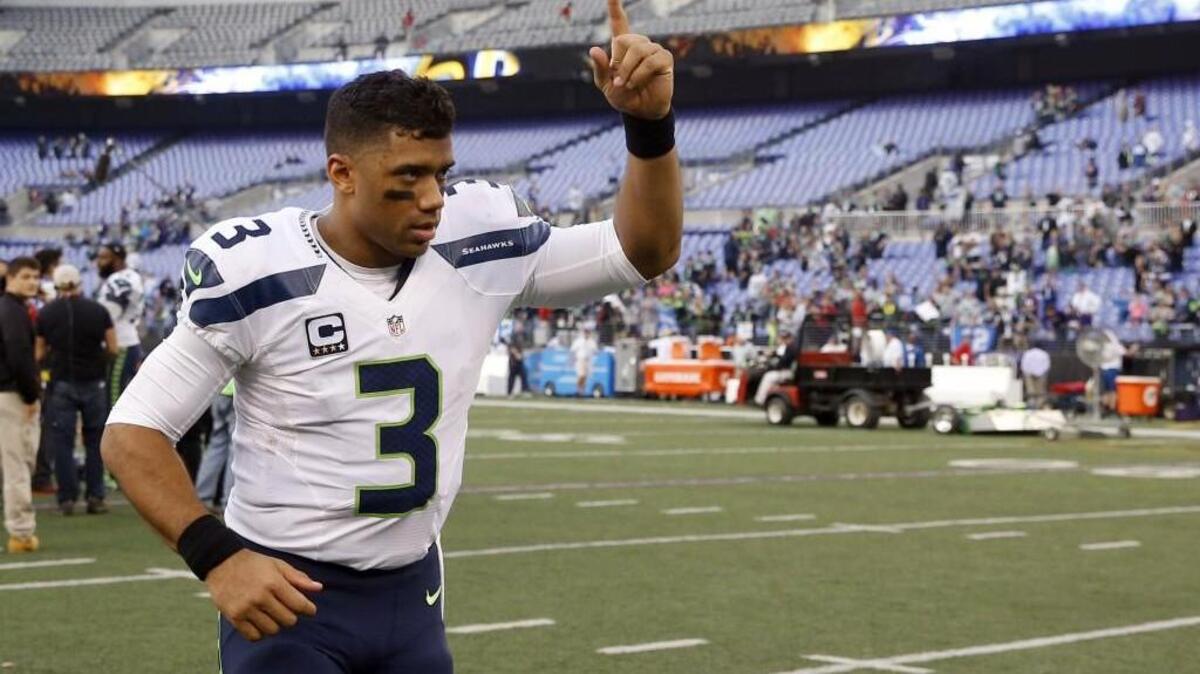 Seattle Seahawks quarterback Russell Wilson (3) reacts as he jogs off the field after an NFL football game against the Baltimore Ravens, Sunday, Dec. 13, 2015, in Baltimore. The Seahawks won 35-6.