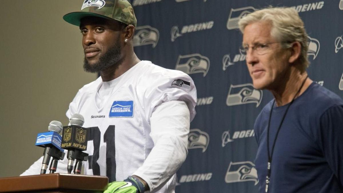 
Seattle Seahawks' Kam Chancellor and coach Pete Carroll talk about Chancellor's return to the NFL football team after holding out over a contract dispute, at the team headquarters in Renton on Wednesday, Sept. 23, 2015.
