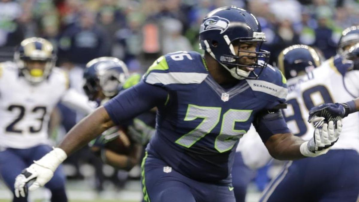 Seattle Seahawks offensive tackle Russell Okung (76) squares off on a play against the St. Louis Rams in the second half of an NFL football game, Sunday, Dec. 28, 2014, in Seattle.