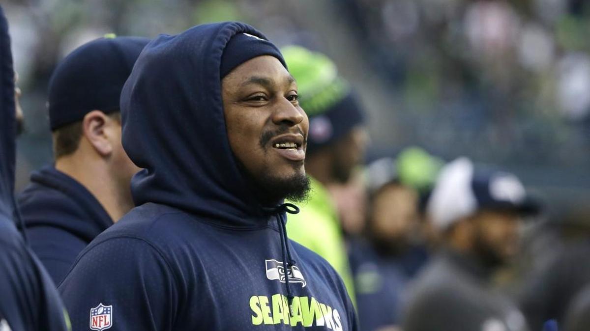 Seattle Seahawks running back Marshawn Lynch watches from the sideline during the Seahawks’ 29-13 win Sunday over the San Francisco 49ers in Seattle. Lynch did not play in the game.