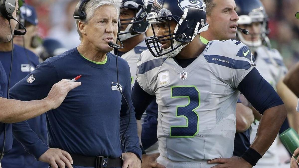 Seattle Seahawks head coach Pete Carroll, left, stands next to quarterback Russell Wilson (3) on the sideline during a game against the San Francisco 49ers on Thursday.