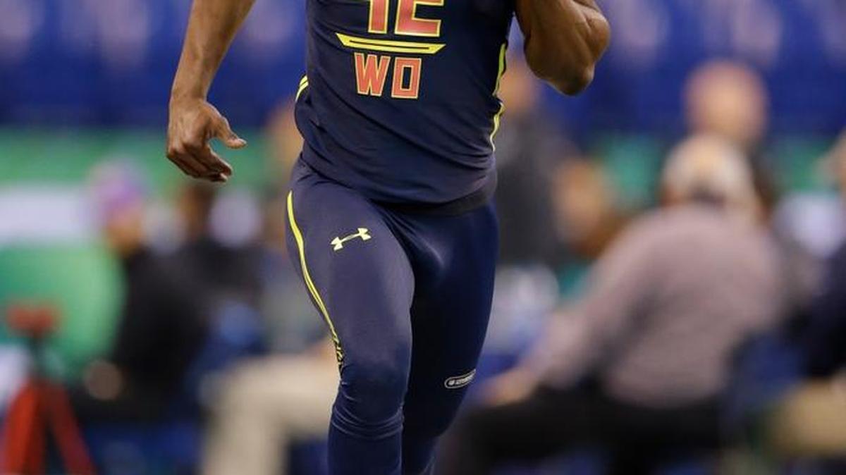 Washington wide receiver John Ross ran the 40-yard dash in 4.22 seconds at the NFL combine, setting a new record for the event.