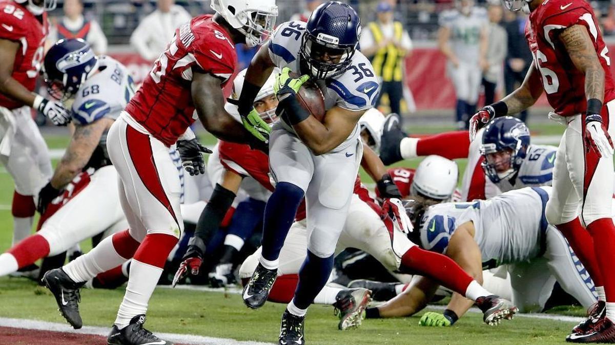 Seattle Seahawks running back Bryce Brown (36) scores a touchdown as Arizona Cardinals linebacker Sean Witherspoon (55) defends during the first half of an NFL football game, Sunday, Jan. 3, 2016, in Glendale, Ariz.