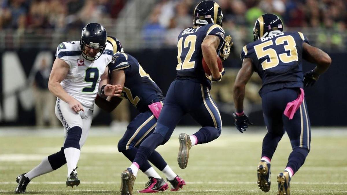 
St. Louis Rams punt returner Stedman Bailey, second from right, gets past Seattle Seahawks punter Jon Ryan, left, as he returns a punt for a touchdown in second quarter action during an NFL football game Sunday, Oct. 19, 2014, at the Edward Jones Dome in St. Louis. Blocking at second from left is Trey Watts and at right is Daren Bates.
