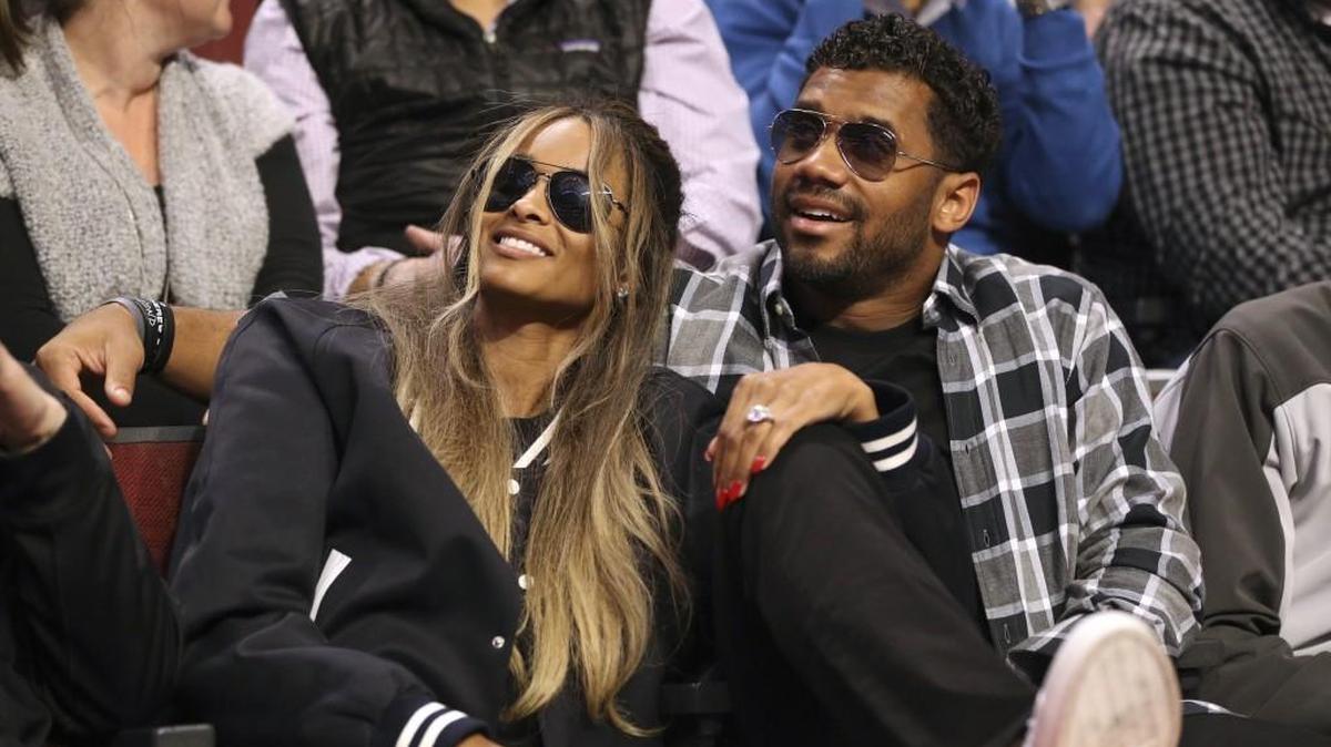 Seahawks quarterback Russell Wilson, shown here in Chicago last month with Ciara watching his sister Anna play in the McDonald's Girls All-American basketball game, made a surprise appearance with his fiancee Wednesday at the annual WE Day Seattle at Key Arena.