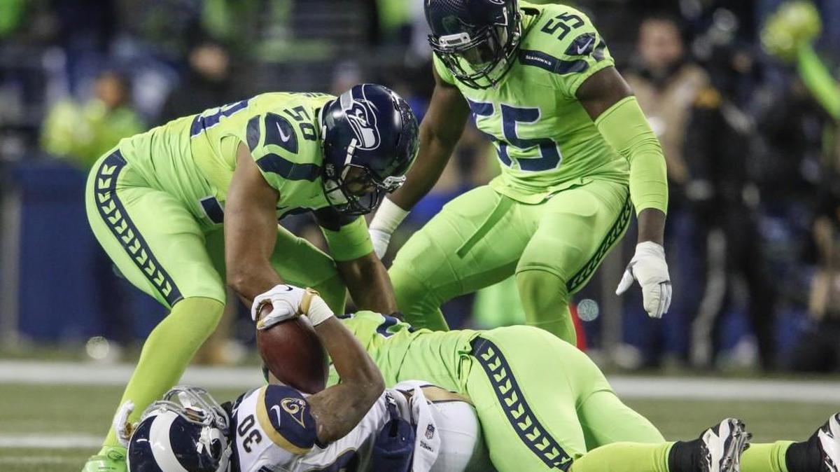 Michael Bennett (72) doing more of this Saturday night--getting into the opposing backfield with fellow defensive end Frank Clark (55)--is a key to the Seahawks’ home playoff game against Detroit Saturday night.