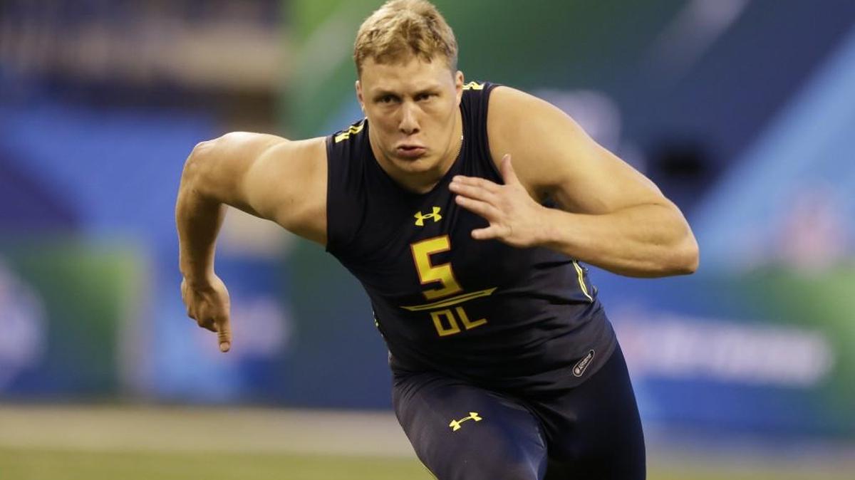 Utah offensive tackle Garett Bolles, here in a running a drill at the NFL scouting combine in Indianapolis last month, is the best athlete at his position in this draft. But that’s not even half the soon-to-be-25-year-old’s remarkable story.