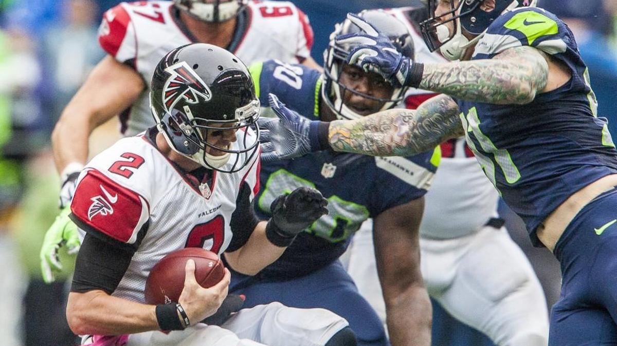 Seahawk Cassius Marsh gives Falcons quarterback Matt Ryan one of Seattle’s four sacks by Seattle in its home win over Atlanta Oct. 16. Those tied for the most sacks against the NFL 4,900-yard passer in the regular season. The rematch is Saturday at the Georgia Dome -- for a spot in the NFC championship game.