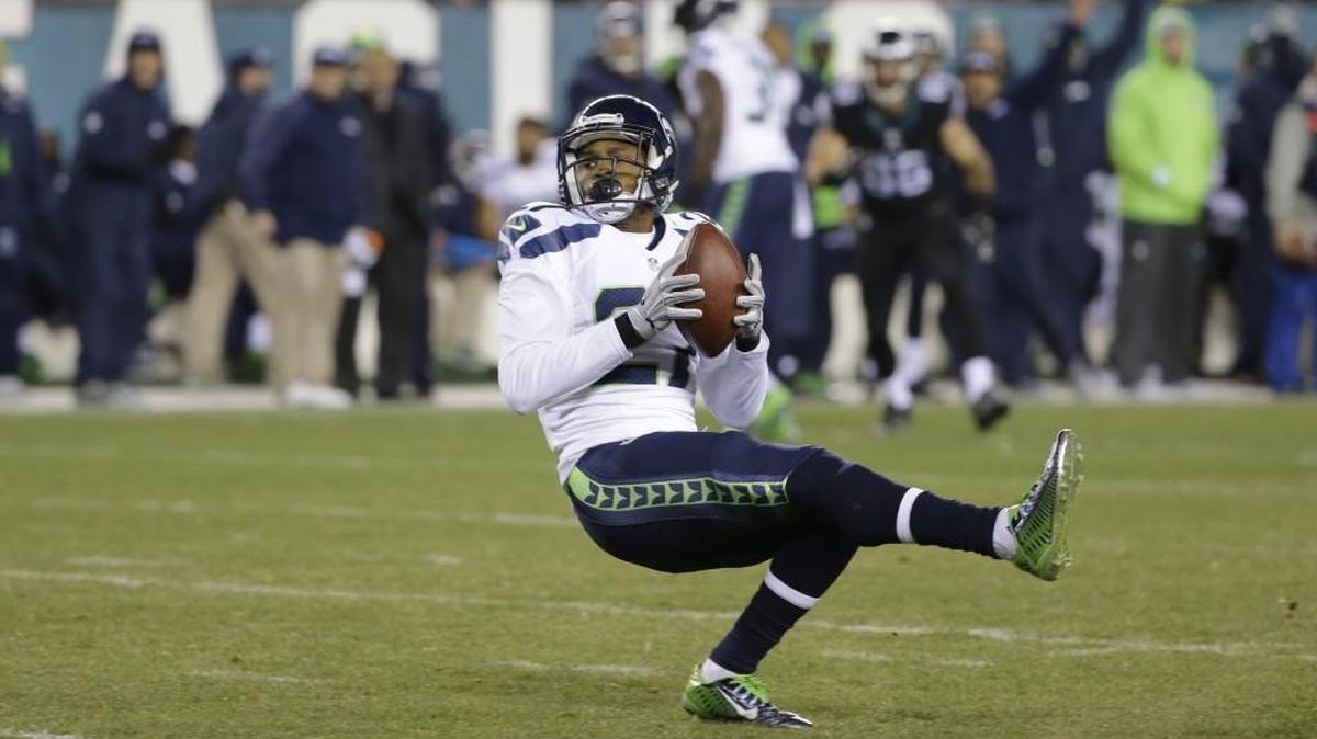 
Cornerback Tharold Simon, here intercepting a pass in December at Philadelphia, has been unable to stay healthy for most of his three seasons with the Seahawks. He went on the injured-reserve list Saturday, ending his season. 
