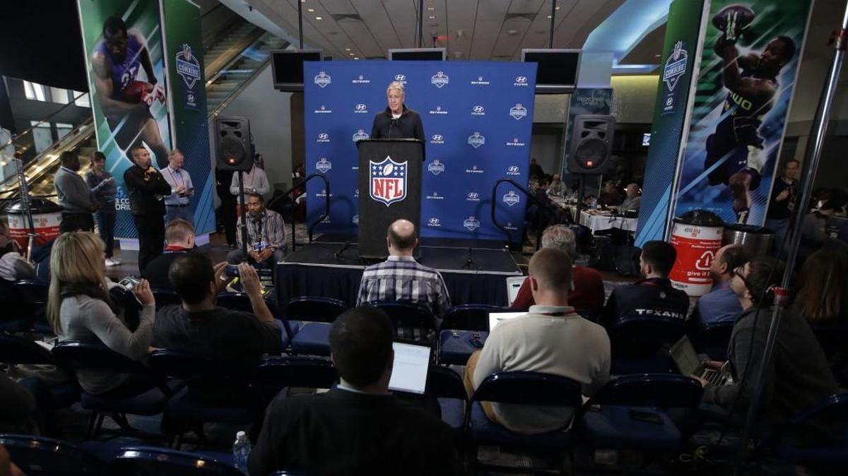 Pete Carroll talking to media members, including some short-haired dude in a lightly colored sweater in row 2, Thursday at the NFL combine in Indianapolis.