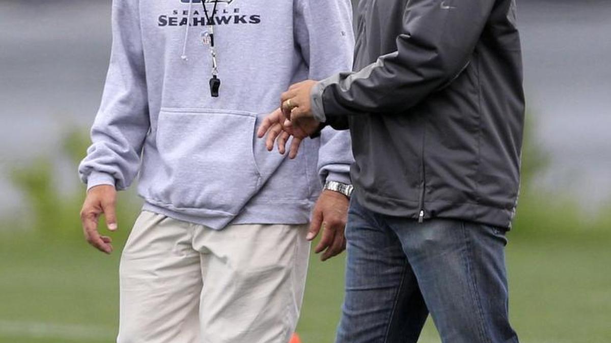 
Seahawks coach Pete Carroll, left, chats with Steve Sarkisian at Seattle’s team headquarters in Renton in May 2010, when Sarkisian was the University of Washington’s coach visiting his mentor from USC.
