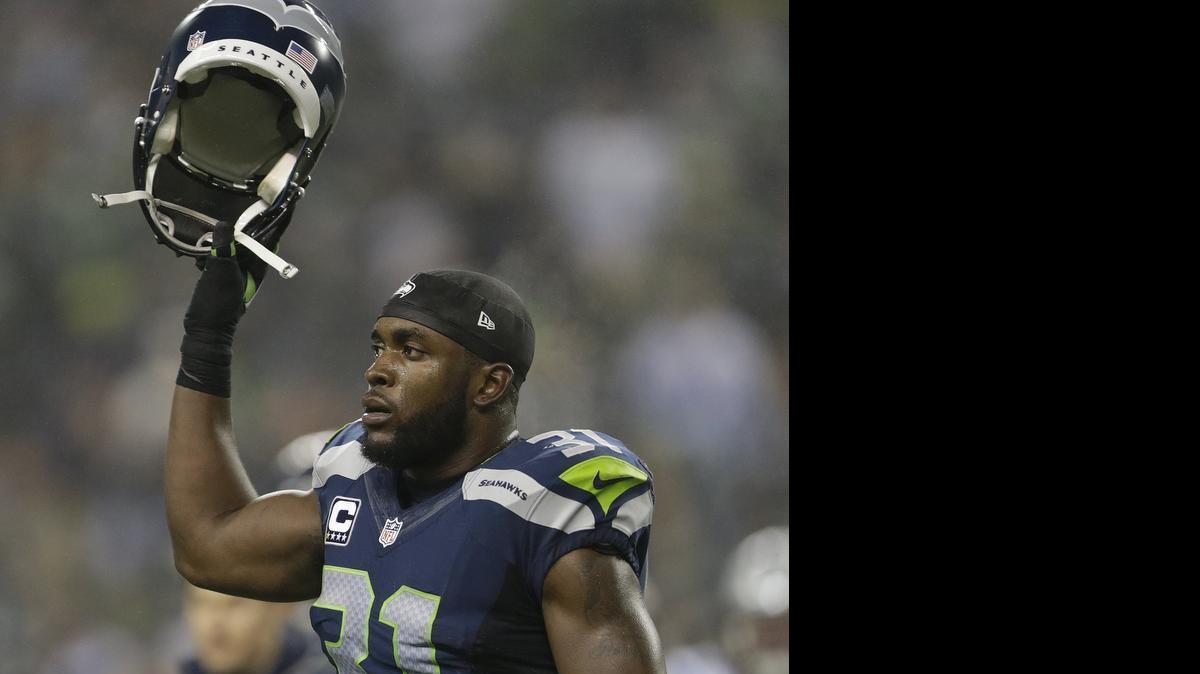
Seattle Seahawks strong safety Kam Chancellor (31) against the Carolina Panthers during the first half of an NFL divisional playoff football game last January. A report today from NFL Network says Chancellor wants more money and is considering a hold out from training camp that begins Friday. 
