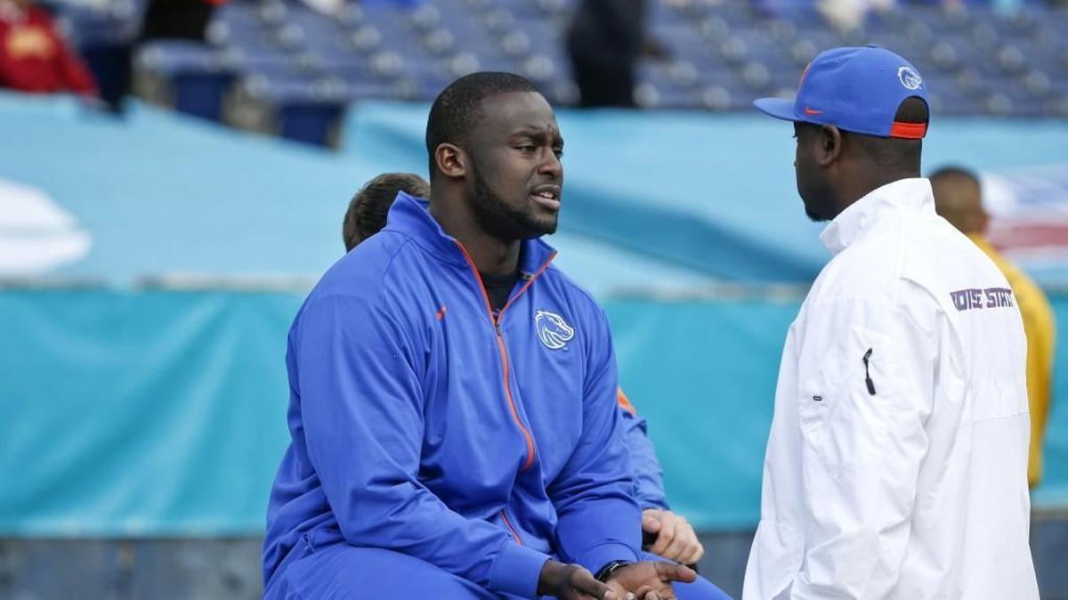 Boise State offensive lineman Rees Odhiambo waits for the start of the NCAA college football Poinsettia Bowl Wednesday, Dec. 23, 2015, in San Diego. Odhiambo was nursing a sore ankle and did not play in the game.