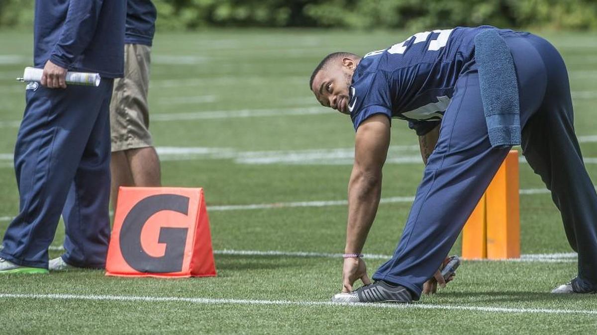 Running back Thomas Rawls, who broke his ankle in early December after establishing himself as Marshawn Lynch’s heir, stretches before the Seahawks’ fifth OTA practice of the offseason Wednesday in Renton.