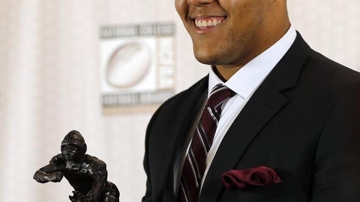 Stanford's Joshua Garnett from Puyallup High School poses after winning the Outland trophy for the being the nation's best interior lineman at the College Football Hall of Fame in Atlanta on Dec. 10. The Seahawks have met with him this week at the NFL combine.