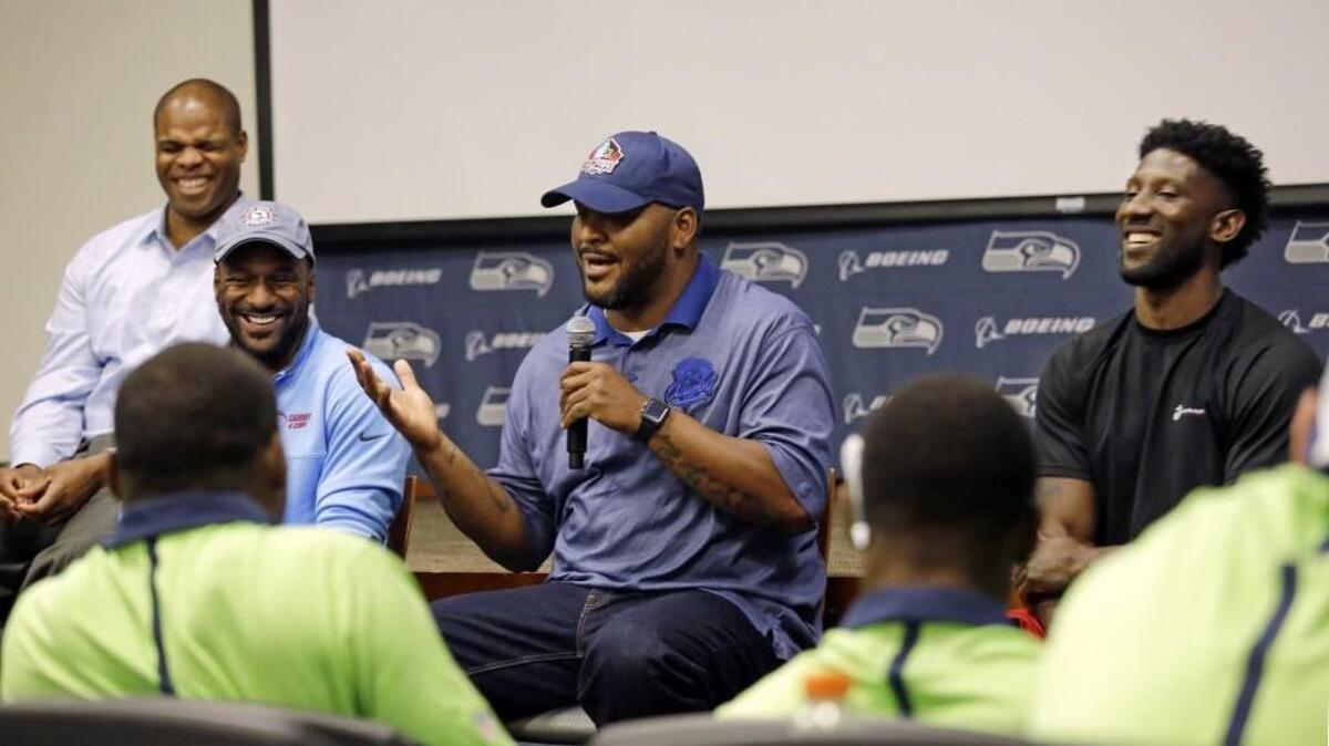 Seahawks Hall-of-Fame left tackle Walter Jones, 42, is a happy dad of 16-year-old twins while living the retired life in Renton. Here he jokes Monday while speaking with fellow ex-Seahawks at the team’s rookie-transition training program.