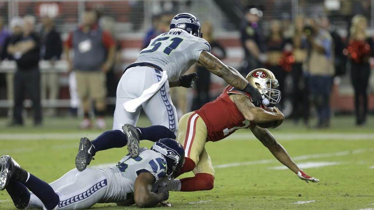 Cliff Avril, here with Bruce Irvin (51) sacking 49ers QB Colin Kaepernick, continued his standout season Thursday night for a revived Seahawks defense.