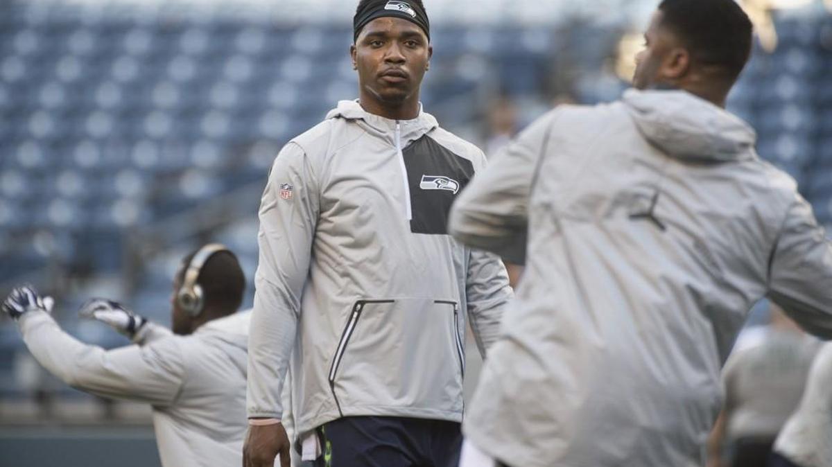 Seahawks backup quarterback Trevone Boykin, here watching Russell Wilson as they run drills before an exhibition game last August, is training with Wilson and other teammates at USC while he awaits a court hearing in Texas.