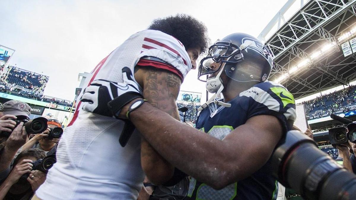 Seahawks wide receiver Doug Baldwin, right, talks with San Francisco 49ers quarterback Colin Kaepernick after last Sunday’s game at CenturyLink Field. Baldwin and Kaepernick have been talking often recently about their protests of race relations in America.