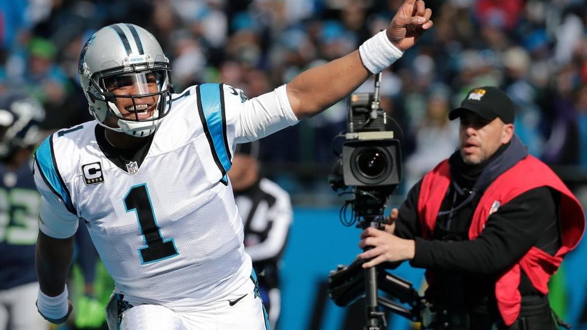 Carolina Panthers quarterback Cam Newton (1) celebrates a Carolina Panthers running back Jonathan Stewart touchdown against the Seattle Seahawks during the first half of an NFL divisional playoff football game, Sunday, Jan. 17, 2016, in Charlotte, N.C.