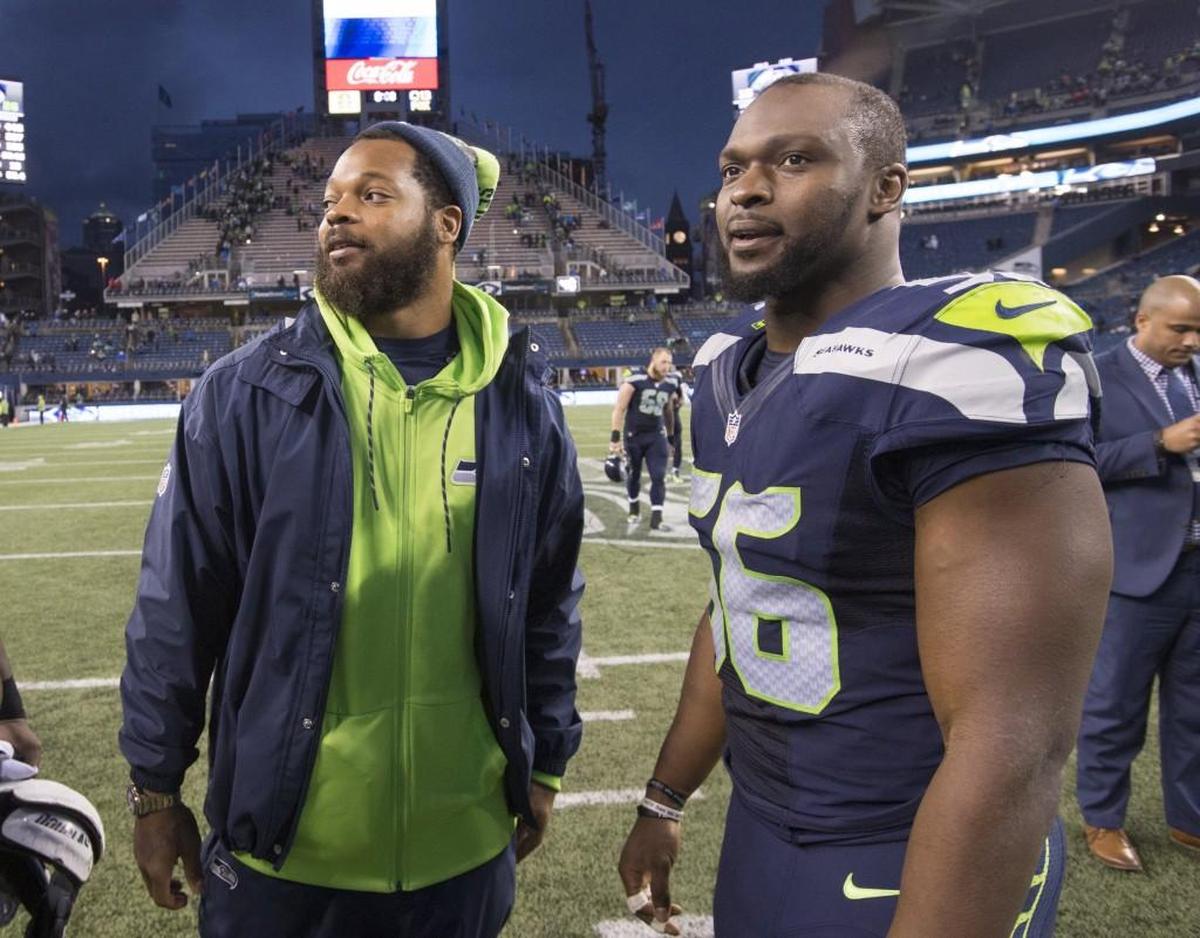 Seahawks Pro Bowl defensive end Michael Bennett (left, with teammate Cliff Avril after the win two weeks ago over Philadelphia) will play Sunday night against Carolina. He’s missed the last five games following arthroscopic knee surgery.