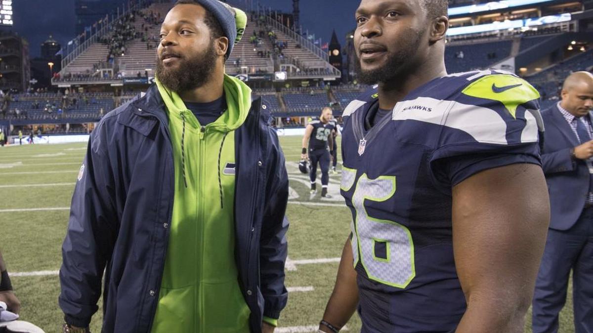 Seahawks Pro Bowl defensive end Michael Bennett (left, with teammate Cliff Avril after the win two weeks ago over Philadelphia) will play Sunday night against Carolina. He’s missed the last five games following arthroscopic knee surgery.
