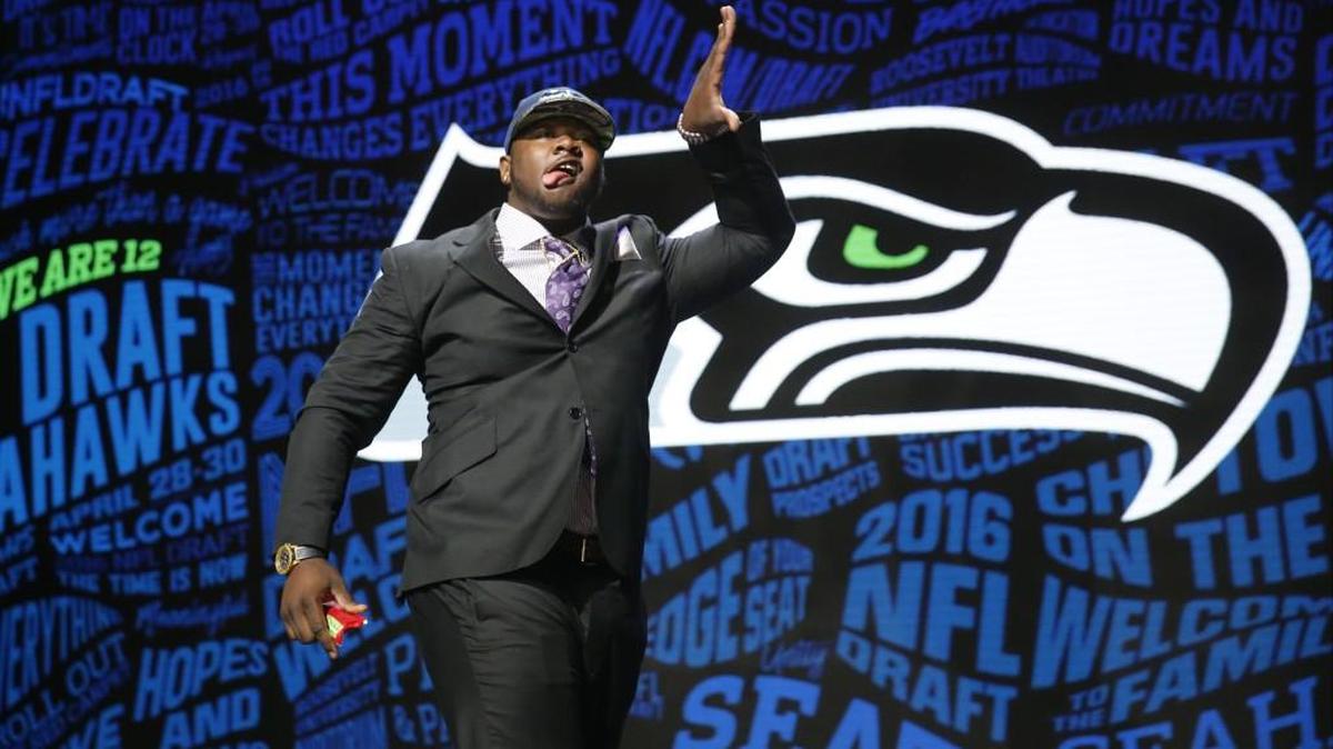 Defensive tackle Jarran Reed, shown here celebrating the Seahawks selecting him in the second round of May’s draft, left practice injured Wednesday but later tweeted he is OK.