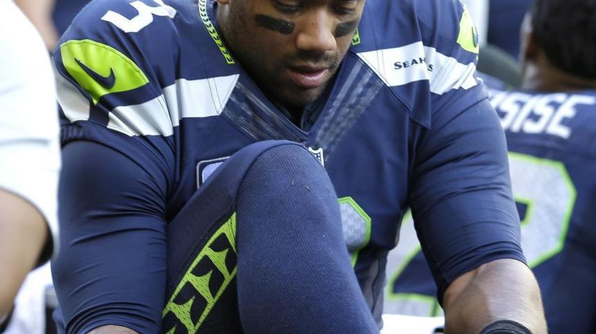 Russell Wilson, here on the training table after he sprained his right ankle in the Seahawks’ opening win over Miami last weekend, was full go for the start of Wednesday’s practice. He’s on track to start Sunday at Los Angeles.