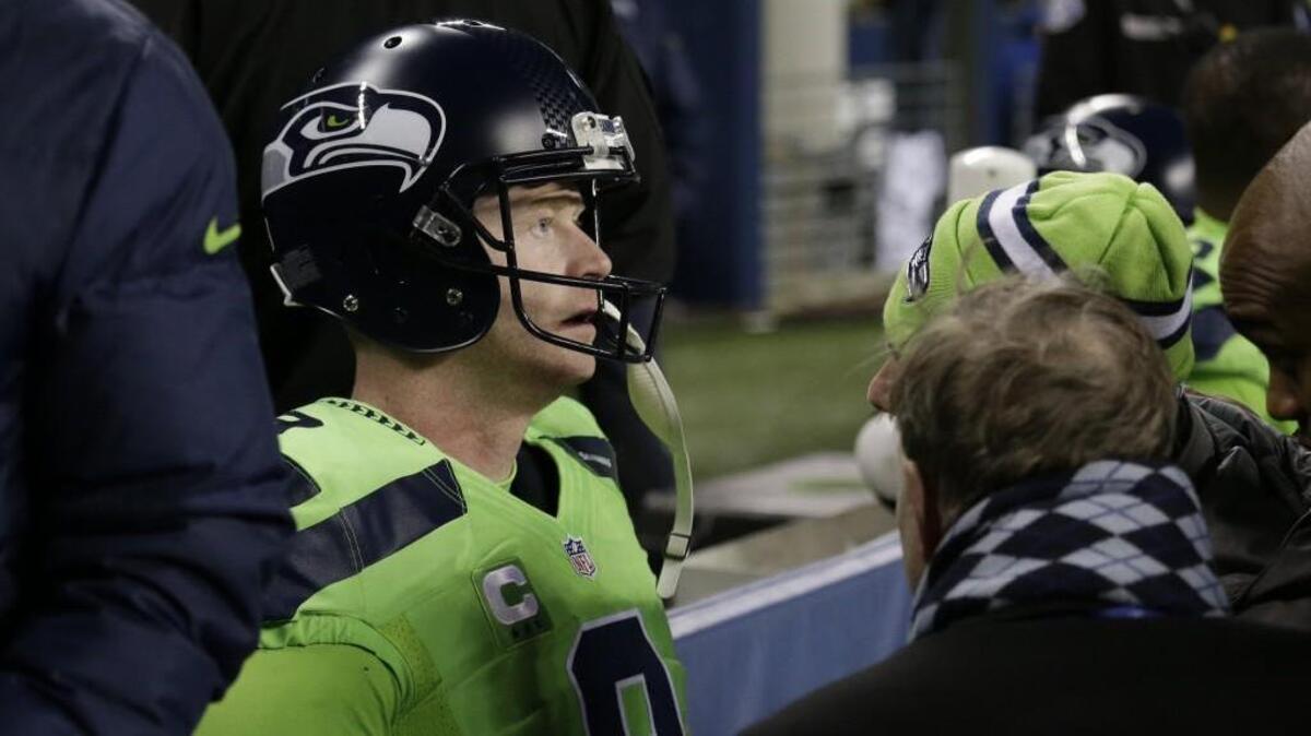 Seahawks punter Jon Ryan sits on the bench looking foggy after getting a concussion from a helmet-to-helmet hit against the Los Angeles Rams on Dec. 15. He apparently will play Saturday for Seattle against Arizona at CenturyLink Field.
