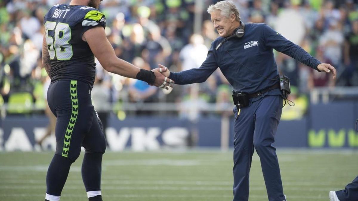 Center Justin Britt (left), a Seahawks’ revelation this season in his third season in three years, missed his second consecutive practice with a new ankle injury. He is iffy for Sunday’s game at Tampa Bay.