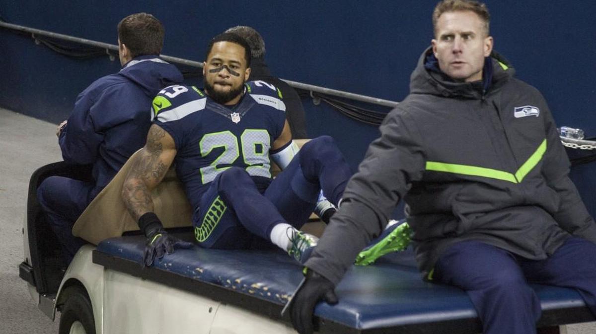 Seahawks safety Earl Thomas is carted into the tunnel at CenturyLink Field after he broke his shin bone in his left leg during Sunday night’s win over Carolina. Coach Pete Carroll said Monday his three-time All-Pro has “no shot” to return this season.