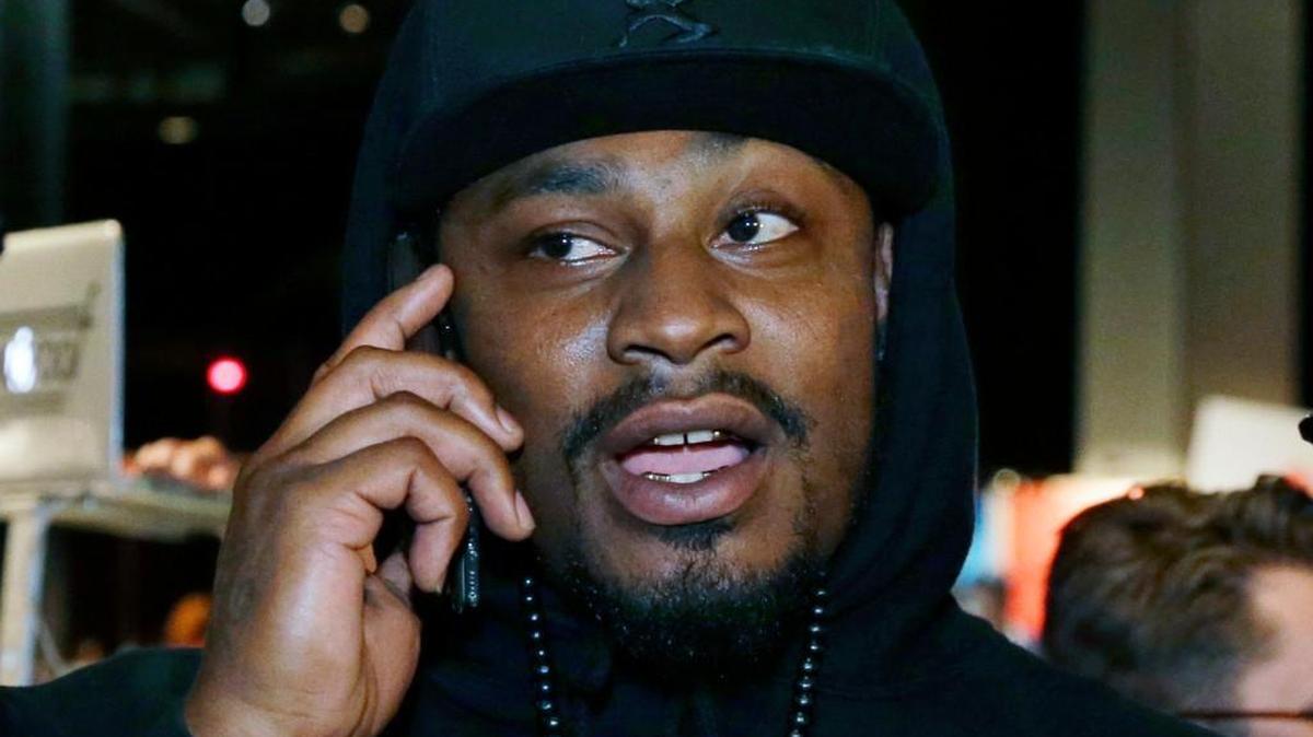 In this May 5, 2016, file photo, Marshawn Lynch talks on the phone after giving a speech at a job fair in Seattle. Lynch put to rest any lingering speculation about a possible return to the NFL in an interview with 60 Minutes Sports that aired Tuesday.