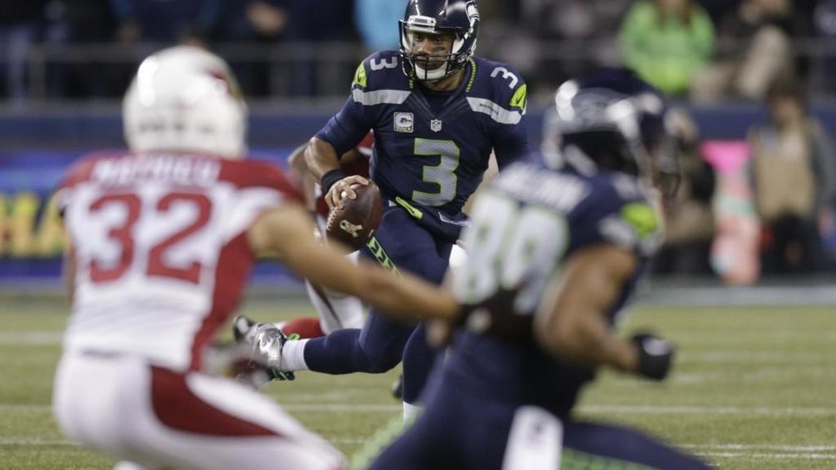 Seattle Seahawks quarterback Russell Wilson (3) looks to pass against the Arizona Cardinals in the first half of an NFL football game, Sunday, Nov. 15, 2015, in Seattle.