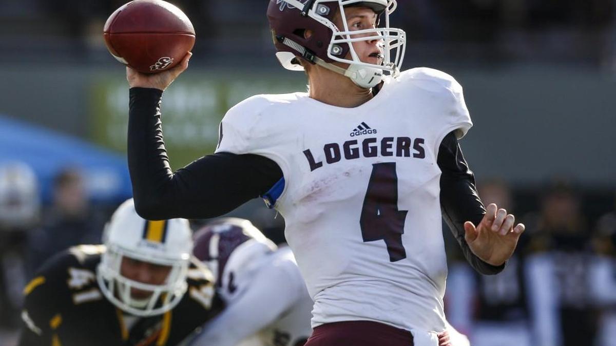 Puget Sound's Hans Fortune (4), throwing here in October against Pacific Lutheran at Sparks Stadium in Puyallup, is one of 55 former college players scheduled to participate in Saturday’s NFL regional combine at Seahawks headquarters in Renton.