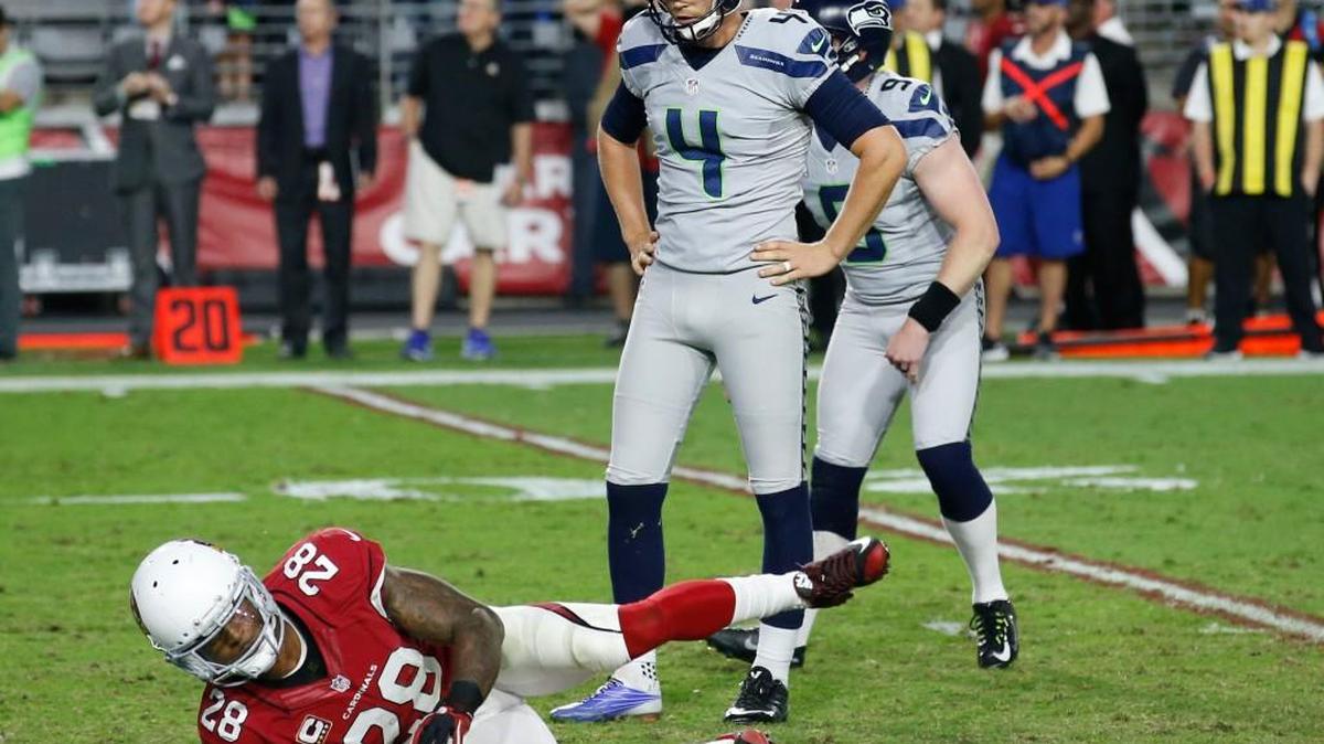 Seattle Seahawks kicker Stephen Hauschka (4) reacts to missing a game-winning field goal as punter Jon Ryan (9) looks on during overtime as Arizona Cardinals cornerback Justin Bethel (28) falls, Sunday, Oct. 23, 2016, in Glendale, Ariz. The game ended in overtime in a 6-6 tie.