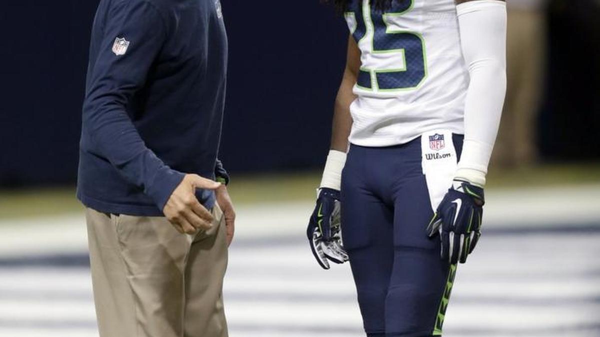 
Seahawks All-Pro cornerback Richard Sherman and coach Pete Carroll talk before the opening-season loss at St. Louis on Sunday. Seattle’s defense allowed 34 point, its most in 35 games
