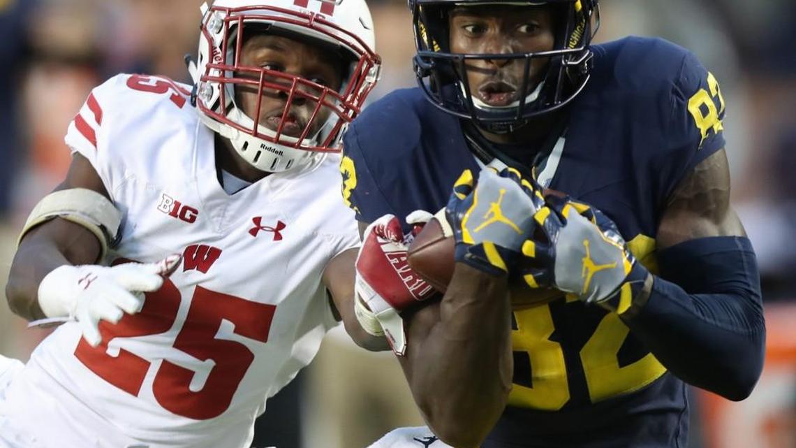 Michigan's Amara Darboh, here making the game-winning catch against Wisconsin's Derrick Tindal in October in Ann Arbor, Mich., was Seattle’s choice at the end of Friday’s third round of the NFL draft. But he is so much more than that.