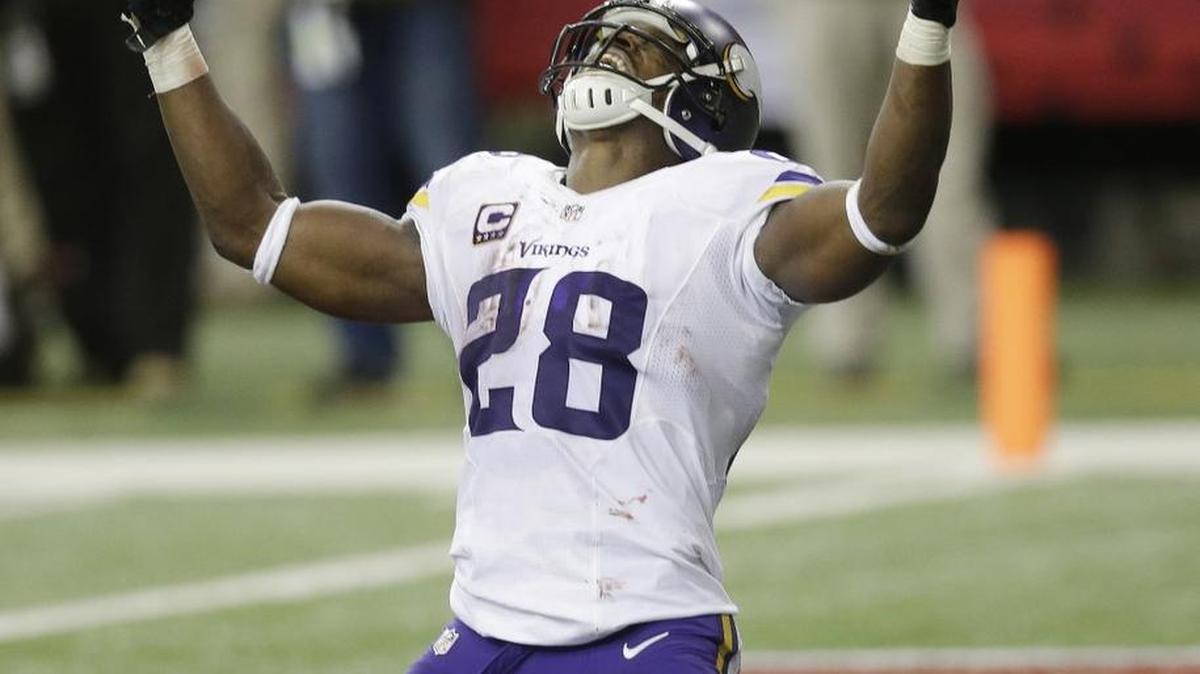 Vikings star Adrian Peterson, the league’s leading rusher, celebrates his touchdown against Atlanta last weekend. He is the Seahawks’ biggest challenge for Sunday at Minnesota. (AP Photo/David Goldman)
